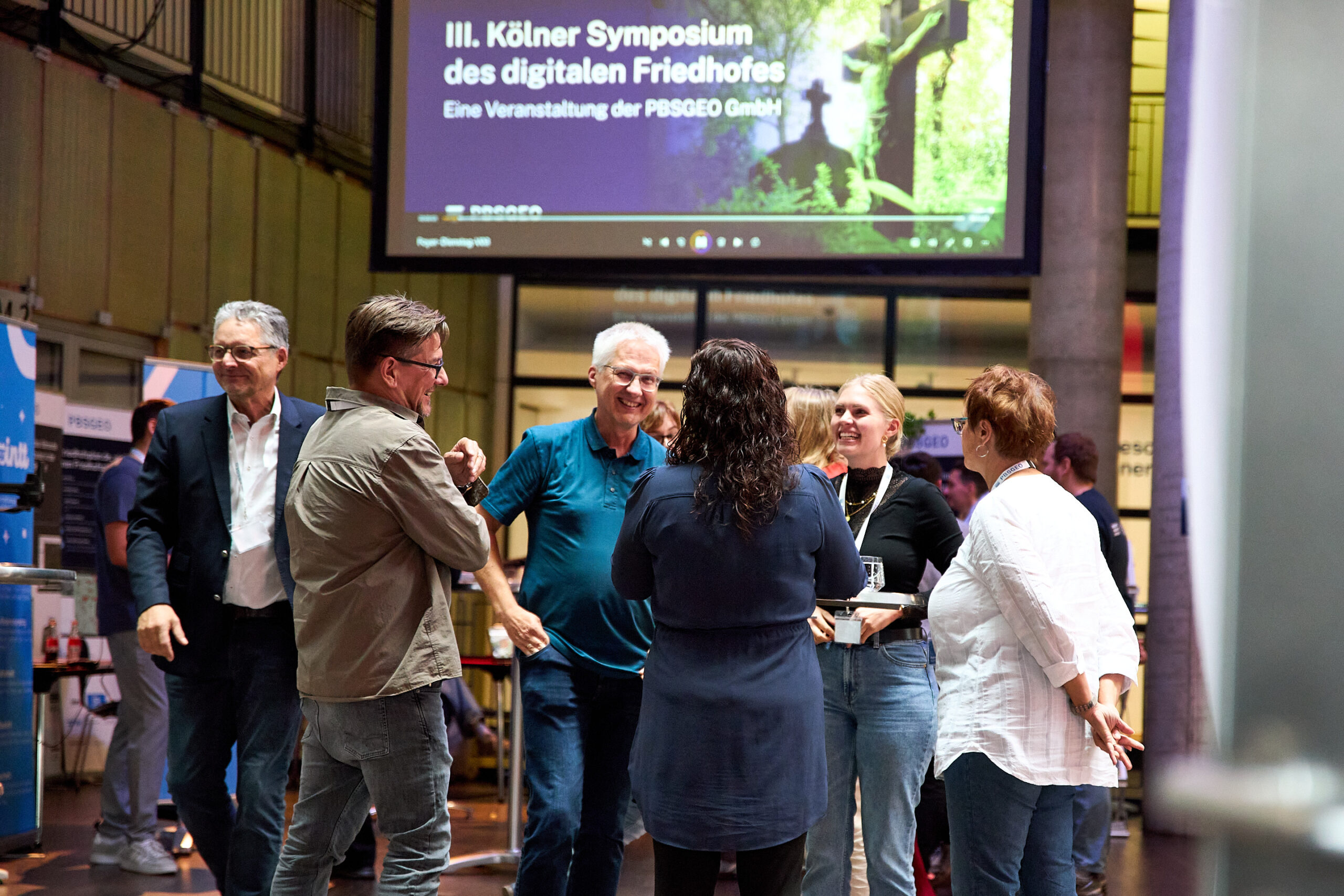 Eventfotografie Symposium Personengruppe im Gespräch